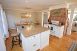 Bright, updated, fully-equipped kitchen with access to back patio